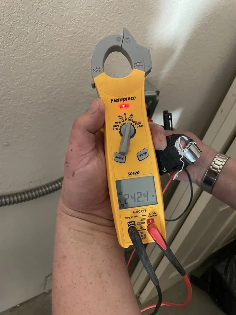 Voltage testing with clamp meter during Outlet Installation in Clute